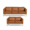 Clausholm sofasæt fra Top-Line monteret med slidstærkt cognacfarvet okselæder grp. 65 og ben i egetræ