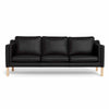 Clausholm 3-pers sofa fra Top-Line monteret med sort semianilin læder og ben i egetræ