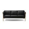 Tessa 3-pers sofa fra Kragelund monteret med sort Luna læder og gavle i sæbebehandlet bøgetræ